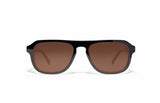 Image of Cheeterz Club eyewear. Photo of retro rectangle sunglasses with brown tinted lenses.  The frames are medium width and black color. Suitable for round, oval, and oblong shaped face shapes. 