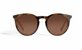 Image of Cheeterz Club eyewear. Photo of retro classic round sunglasses with brown tinted lenses. The frames are medium width and light and dark brown color. Suitable for square, oval, and oblong shaped face shapes. 