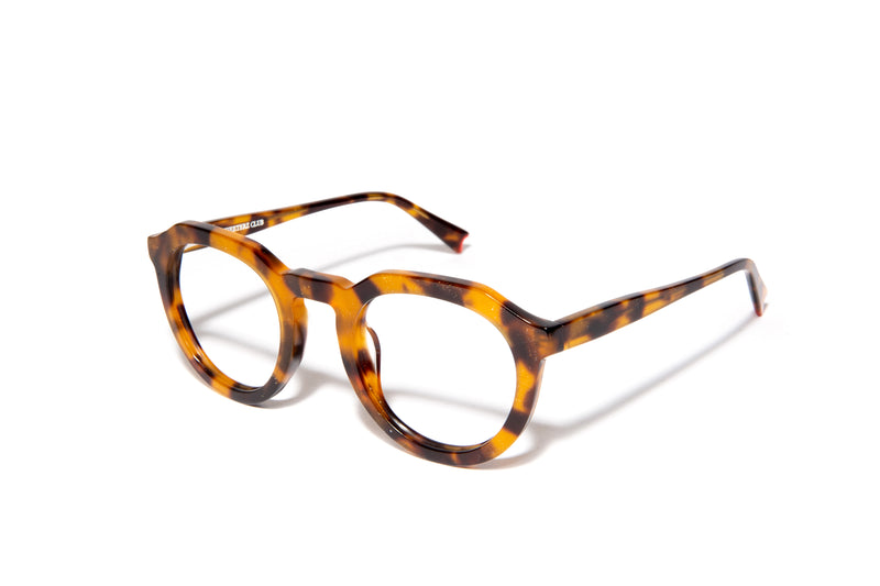 Image of Cheeterz Club eyewear. Photo of round eyeglasses with clear lenses and blue light blocking technology. The frames are medium width with glitter infused golden brown and black color and spotted print, suitable for square, oval, and oblong face shapes. These glasses can be used as reading glasses with blue light glasses.