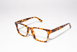  Image of Cheeterz Club eyewear. Photo of retro rectangle eyeglasses with clear lenses and blue light blocking technology. The frames are wide width with honey, golden brown, and dark brown  color. Suitable for round, oval, and square face shapes. These glasses can be used as reading glasses with blue light glasses.