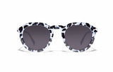 Image of Cheeterz Club eyewear. Photo of round sunglasses with gray tinted lenses. The frames are medium width with white and black color and cheetah print, suitable for square, oval, and oblong face shapes. 