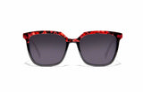 Image of Cheeterz Club eyewear. Photo of square sunglasses with gray tinted lenses. The frames are medium width with a multi print of a black on the lower frame and a fierce red and black marble upper frame. Suitable for round, oval, and heart shaped face shapes. 