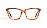 Image of Cheeterz Club eyewear. Photo of cat eye eyeglasses with clear lenses and blue light blocking technology. The frames are medium width and golden brown color with honey and dark brown accents. Suitable for round, oval, and heart shaped face shapes. These glasses can be used as reading glasses with blue light glasses.