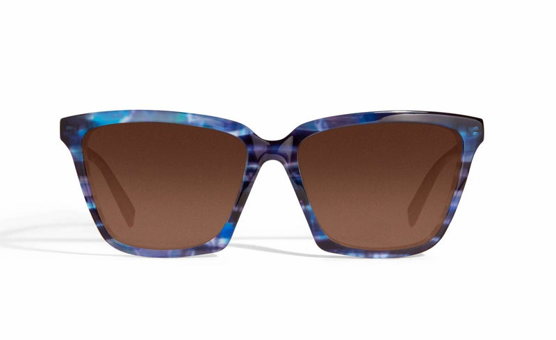 Image of Cheeterz Club eyewear. Photo of cat eye sunglasses with brown tinted lenses.  The frames are medium width with light and dark blue color. Suitable for round, oval, and heart shaped face shapes. 