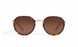 Image of Cheeterz Club eyewear. Photo of round sunglasses with brown tinted lenses.  The frames are small width and golden brown and mahogany color. Suitable for square, oval, and oblong shaped face shapes. 