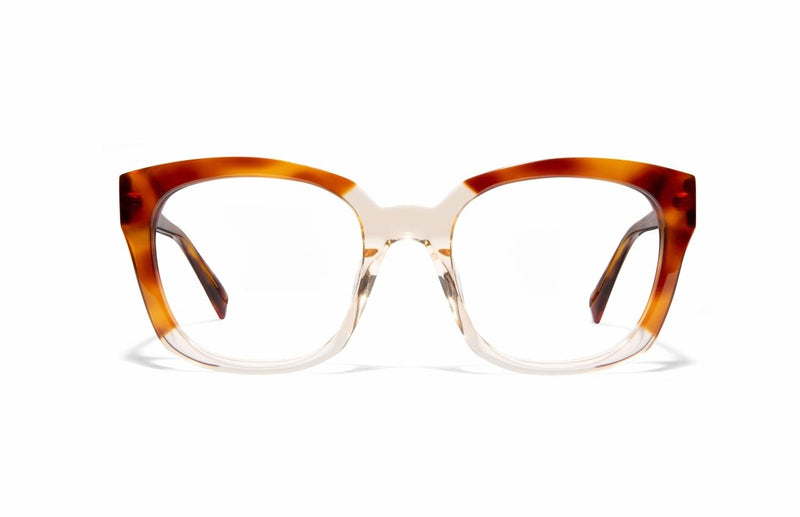  Image of Cheeterz Club eyewear. Photo of square eyeglasses with clear lenses and blue light blocking technology. The frames are wide width and custom laminated shades of honey, golden brown, and nude color with clear bottoms. Suitable for round, oval, and heart face shapes. These glasses can be used as reading glasses with blue light glasses.