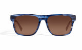 Image of Cheeterz Club eyewear. Photo of chunky square sunglasses with brown tinted lenses.  The frames are wide width with blue and black color. Suitable for round, oval, and square face shapes. 